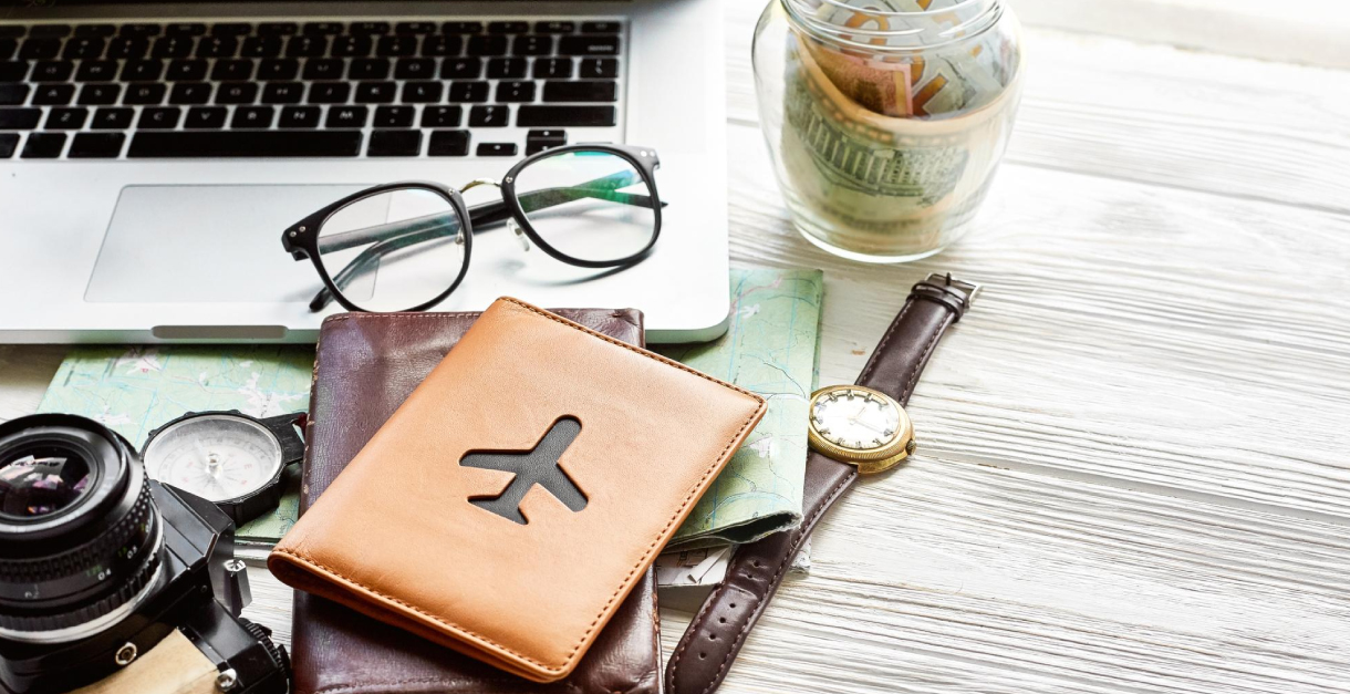 Business professional reviewing travel & expense management reports on a laptop with charts and receipts
